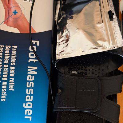 Sale Photo Thumbnail #318: New and unused foot massager featuring pads, instruction manual and all accessories in original box.