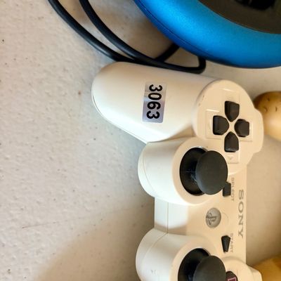Sale Photo Thumbnail #403: This lot includes 6 video game controllers. All in used condition.