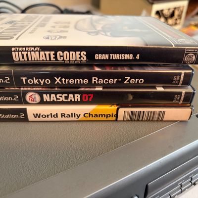 Sale Photo Thumbnail #326: Lot of 4 PS2 games in cases.