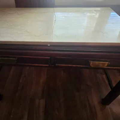 Sale Photo Thumbnail #29: This desk constricted with solid wood.  Marble top is broke into two pieces and is not fastened to the desk.
Selling as is
