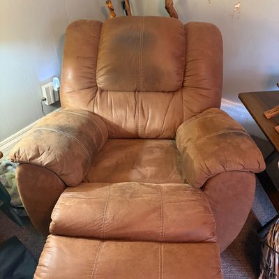 Sale Photo Thumbnail #282: Manual recliner in good working condition with heavy wear. Many stains, pleather.