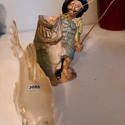 Sale Photo Thumbnail #421: Lot includes the following two items , Large and heavy glass bass and fisherman statue.