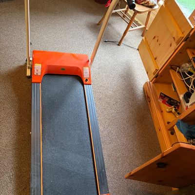Sale Photo Thumbnail #286: Electric treadmill in good working order. Orange and white in color.