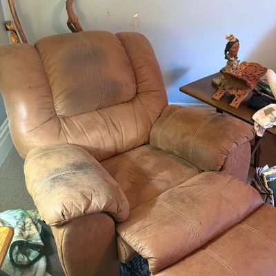 Sale Photo Thumbnail #284: Manual recliner in good working condition with heavy wear. Many stains, pleather.