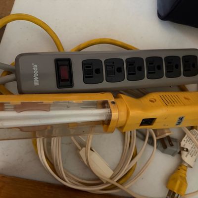 Sale Photo Thumbnail #320: Lot of 2 items including one IIIWoods power strip and a yellow florescent lamp.