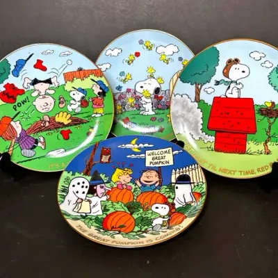 4 Danbury Mint “Peanuts” Plates