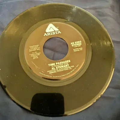 Al Stewart – “Almost Lucy” / “Time Passages” 45 RPM Vinyl Record | Arista 1978