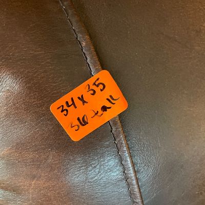 Sale Photo Thumbnail #106: Pair of reclining leather chairs with matching singular ottoman