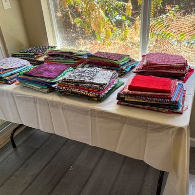 A medium fabric table in the back porch area