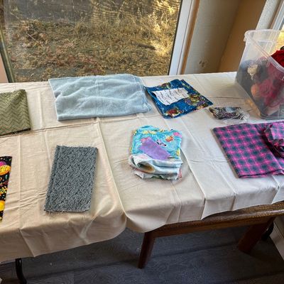 This table will now have the non-cotton fabrics, like flannel and also a box of yarn.