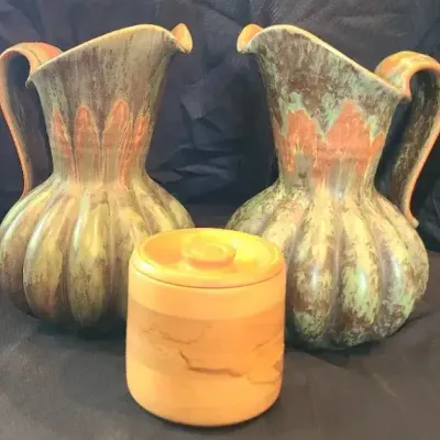 Eclectic Earthtone Pitchers And Warm Wood Jar