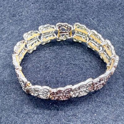 Sale Photo Thumbnail #91: One bracelet made from Liked squares with a stamped butterfly design, the other is a smooth linked set of squares marked "Porodiuti", an stainless steel charm bracelet made in Florence, Italy. Both in good condition.