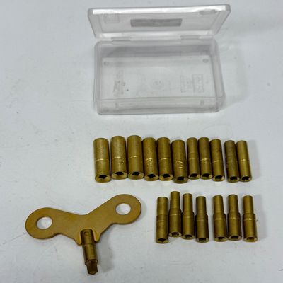 Sale Photo Thumbnail #379: Universal brass clock keys for winding clocks; this clock key set includes 18 sizes from 000 to 15. One handle is supplied with replaceable female bits to fit nearly all winding clocks. Like-new condition in plastic storage box.