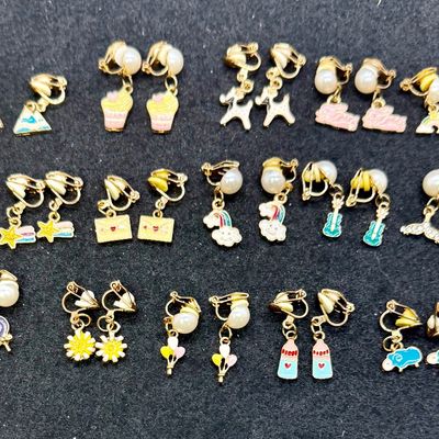Sale Photo Thumbnail #260: 16 Pairs Assorted Clip-on Earrings featuring various playful enameled designs like animals, sweets, and flowers. Good condition.