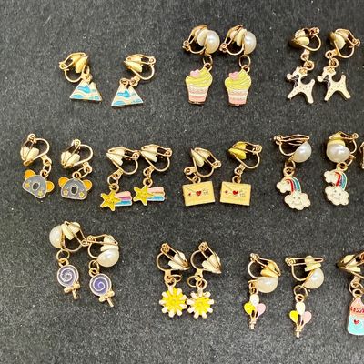 Sale Photo Thumbnail #261: 16 Pairs Assorted Clip-on Earrings featuring various playful enameled designs like animals, sweets, and flowers. Good condition.