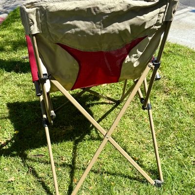 Sale Photo Thumbnail #196: Folding camp chair with cup holder near front of seat.  Good condition, does not have a storage bag.