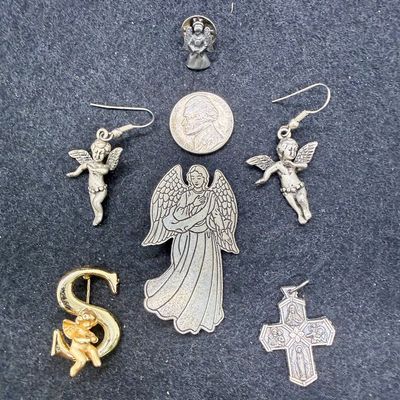 Sale Photo Thumbnail #481: Angel lapel pin, brooch pins, cross pendant, and earrings for pierced ears.