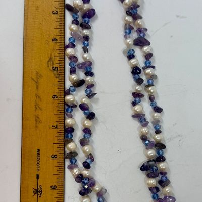 Sale Photo Thumbnail #373: Double-strand beaded necklace featuring white freshwater pearls and purple amethyst chip beads accented with small blue crystals. Good c condition, approx. 45" long.