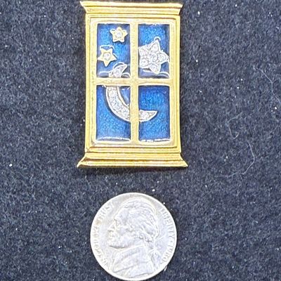 Sale Photo Thumbnail #76: Gold-tone window from with a dark blue sky, and bejeweled moon and stars. In great condition.
