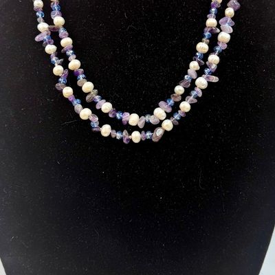 Sale Photo Thumbnail #371: Double-strand beaded necklace featuring white freshwater pearls and purple amethyst chip beads accented with small blue crystals. Good c condition, approx. 45" long.