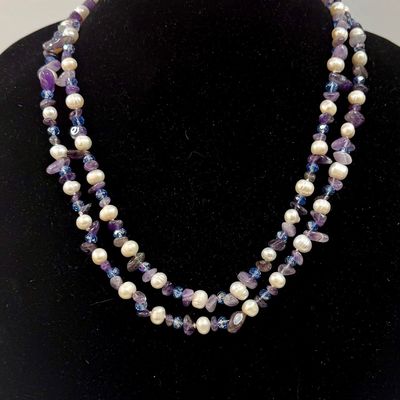 Sale Photo Thumbnail #372: Double-strand beaded necklace featuring white freshwater pearls and purple amethyst chip beads accented with small blue crystals. Good c condition, approx. 45" long.