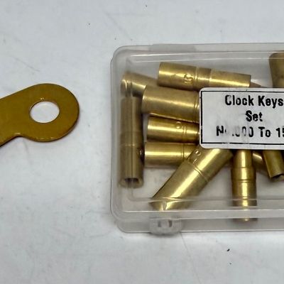 Sale Photo Thumbnail #378: Universal brass clock keys for winding clocks; this clock key set includes 18 sizes from 000 to 15. One handle is supplied with replaceable female bits to fit nearly all winding clocks. Like-new condition in plastic storage box.