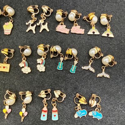 Sale Photo Thumbnail #262: 16 Pairs Assorted Clip-on Earrings featuring various playful enameled designs like animals, sweets, and flowers. Good condition.