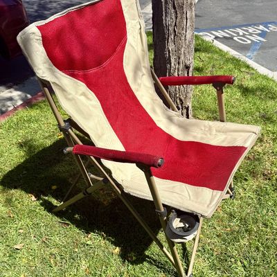 Sale Photo Thumbnail #193: Folding camp chair with cup holder near front of seat.  Good condition, does not have a storage bag.