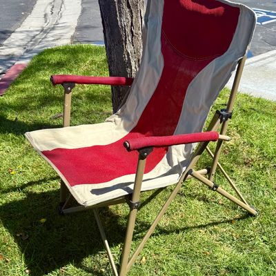 Sale Photo Thumbnail #195: Folding camp chair with cup holder near front of seat.  Good condition, does not have a storage bag.