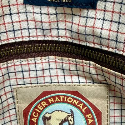 Sale Photo Thumbnail #10: Pendleton Glacier National Park canvas travel bag featuring an ivory body accented with burgundy trim and the iconic multi-color Glacier stripe pattern. Has a telescopic handle and wheels for ease of use. Like-new condition, looks to be sized for carry-on