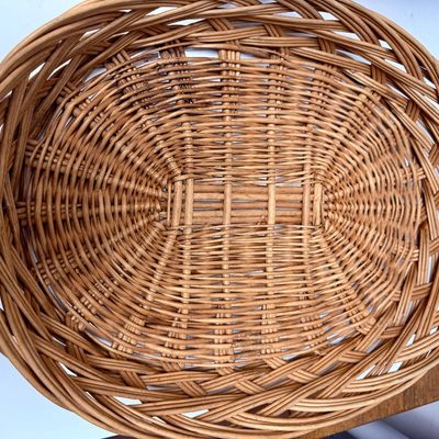 Sale Photo Thumbnail #14: The picnic basket appears to be very old. Has a hinged lid, and a small platform inside with 4 legs, remnant of pale pink paint on the lid. The oval one is in very good condition.
