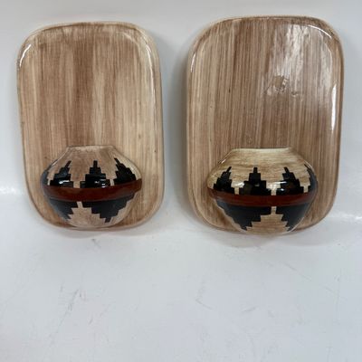 Sale Photo Thumbnail #65: Pair of ceramic plaques made to look like a wood plaque with a small woven southwestern basket.  Each is about the size of a standard light switch, good condition.