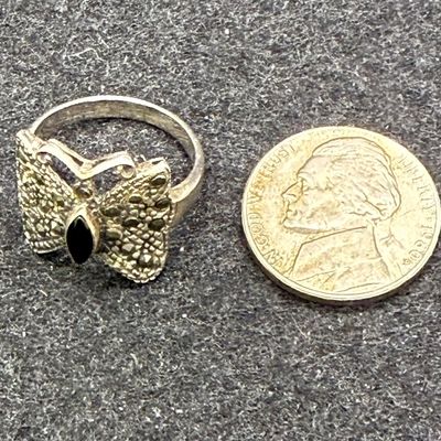 Sale Photo Thumbnail #457: Size 6.5, black stone in body of butterfly. 3.4g total weight.