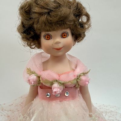 Sale Photo Thumbnail #488: Vintage Robert Tonner Betsy McCall Commemorative Stamp Doll from 1997, dressed in a pink tulle and satin gown with floral accents