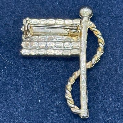 Sale Photo Thumbnail #567: Gold tone pin with red, white and blue rhinestones. Good condition.