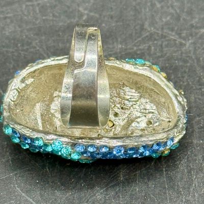 Sale Photo Thumbnail #560: Silvertone adjustable statement ring, good condition.