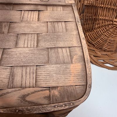Sale Photo Thumbnail #16: The picnic basket appears to be very old. Has a hinged lid, and a small platform inside with 4 legs, remnant of pale pink paint on the lid. The oval one is in very good condition.