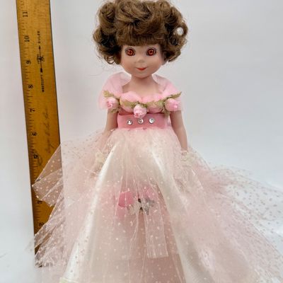 Sale Photo Thumbnail #493: Vintage Robert Tonner Betsy McCall Commemorative Stamp Doll from 1997, dressed in a pink tulle and satin gown with floral accents