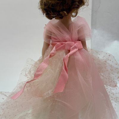 Sale Photo Thumbnail #487: Vintage Robert Tonner Betsy McCall Commemorative Stamp Doll from 1997, dressed in a pink tulle and satin gown with floral accents