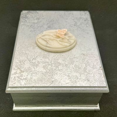 Sale Photo Thumbnail #460: Silver-colored hinged lid box for jewelry or other small items. Good condition, measures approx. 7.5” x 5.5”.