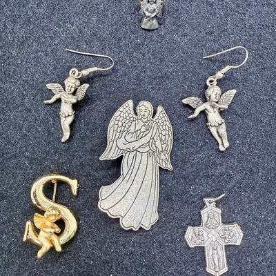 Sale Photo Thumbnail #480: Angel lapel pin, brooch pins, cross pendant, and earrings for pierced ears.