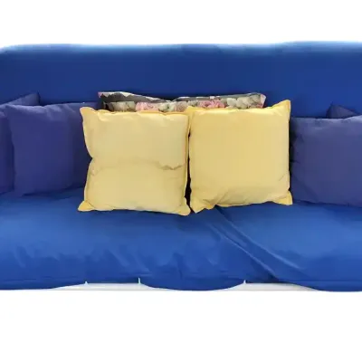 White Metal Futon Sofa Bed With Blue Mattress and Accent Pillows