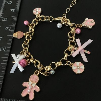 Cute gold tone fashion bracelet with charms