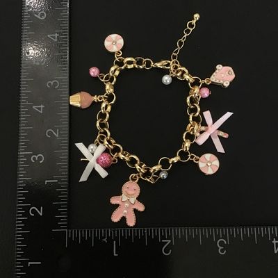 Cute gold tone fashion bracelet with charms