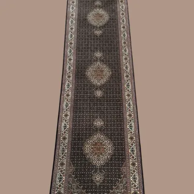 Dark traditional runner with repeating medallion design