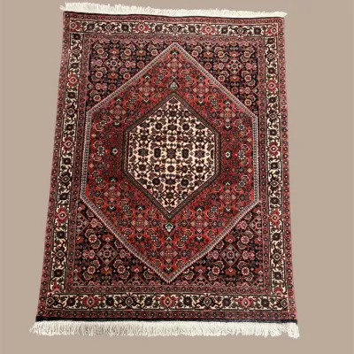 Traditional red area rug with central geometric medallion