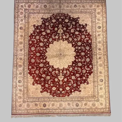 Ivory and burgundy traditional area rug with large floral medallion