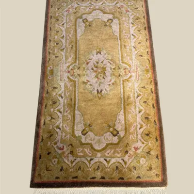 Ornate gold and ivory traditional rug with decorative central medallion