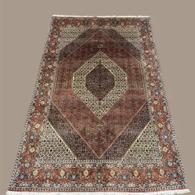 Warm-toned geometric area rug with diamond medallion