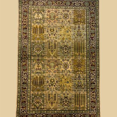 Olive and gold traditional rug with intricate repeating pattern